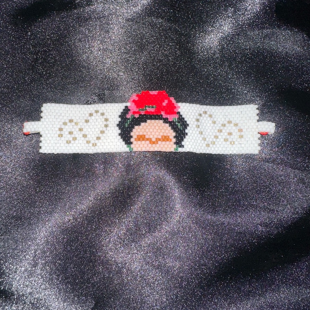 Handmade Beaded Bracelet with Red and White Design